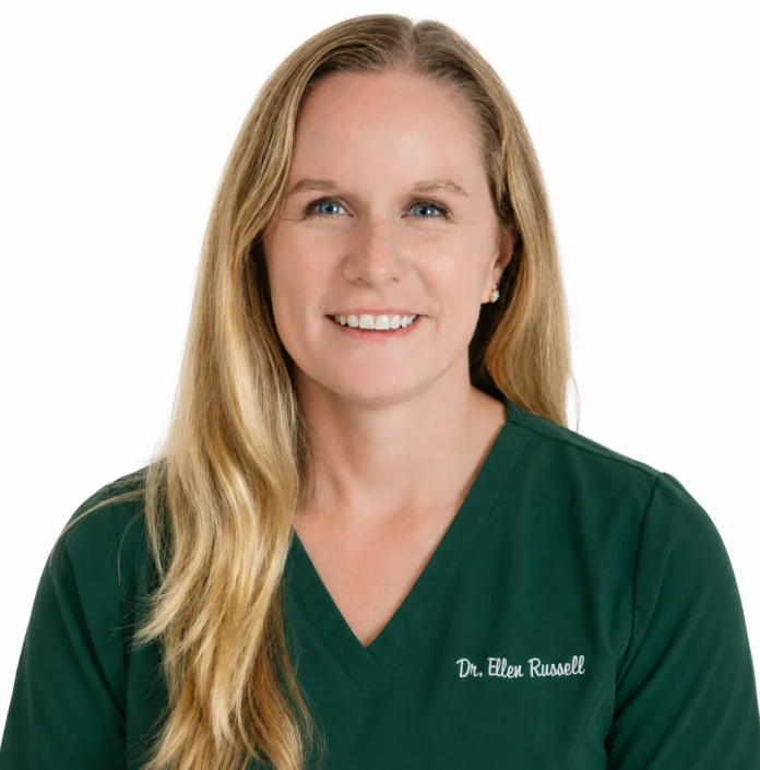 Dr. Ellen Russell, Everfur’s Chief Medical Director, in green scrubs